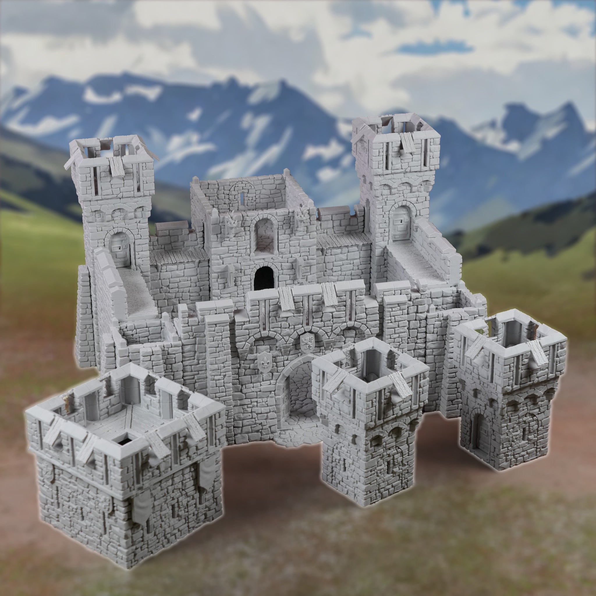 Modulares graues Miniatur-Fort mit Burgtürmen, Mauern und Rundtürmen vor Bergkulisse.